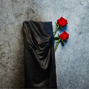 Black Designer strapless Dress with side pockets. Comes with attachable straps.